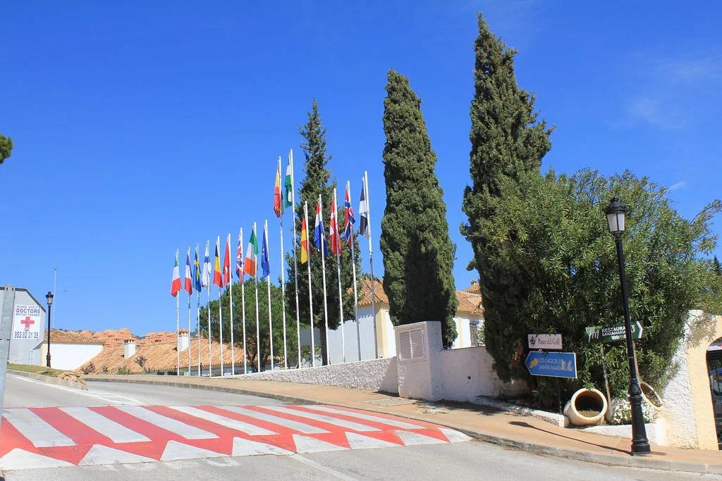 Flags at the entrance to Santa María Golf, Elviria, Marbella